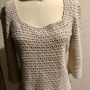 Knit top with scoop neck and long bell sleeves.